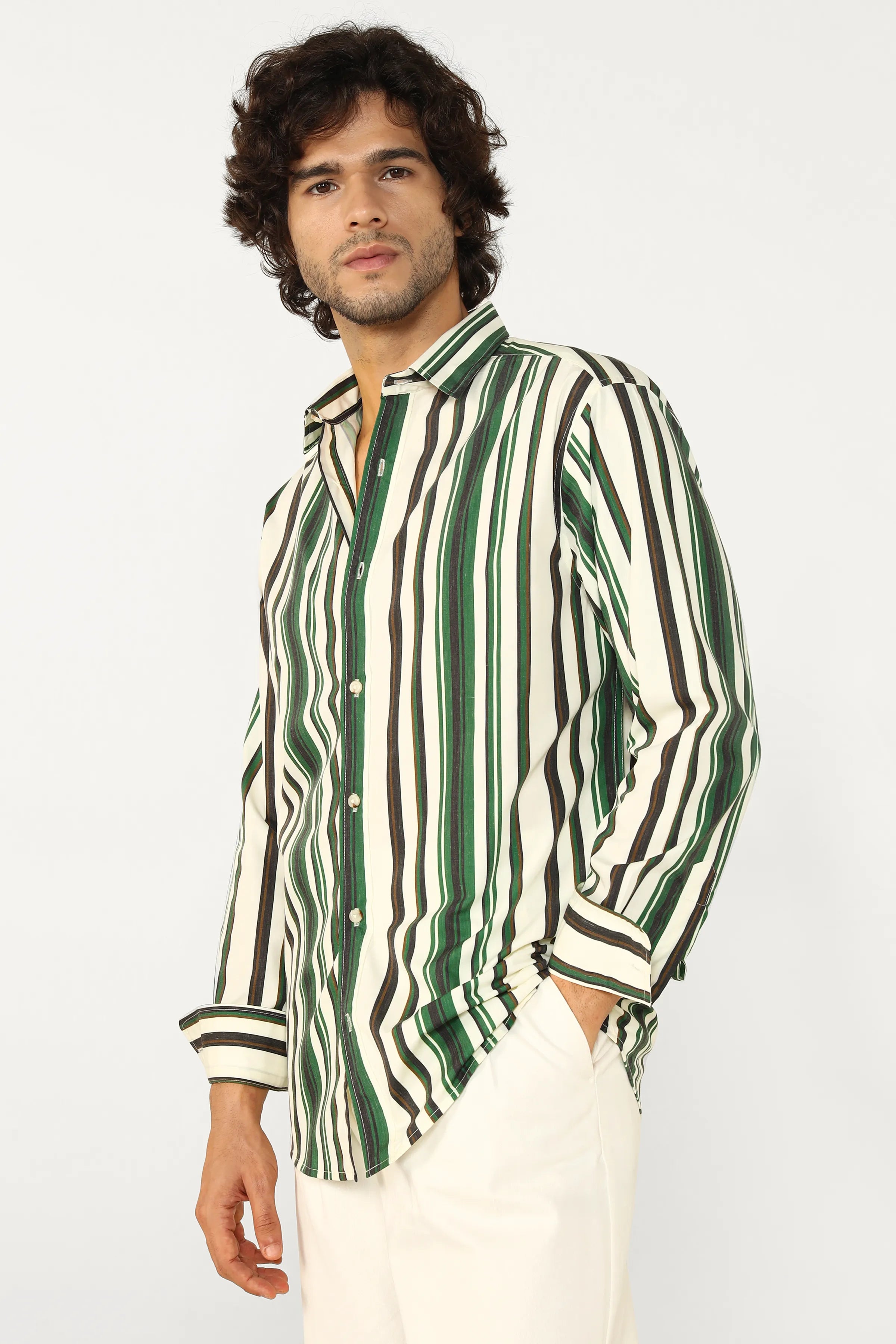 Man wearing a green and white striped shirt on a white background