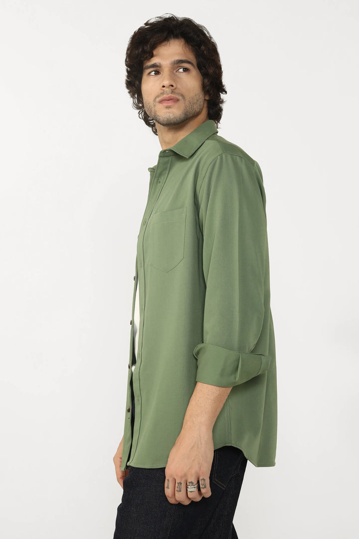 Man wearing a Jade Cotton Twill shirt on a white background
