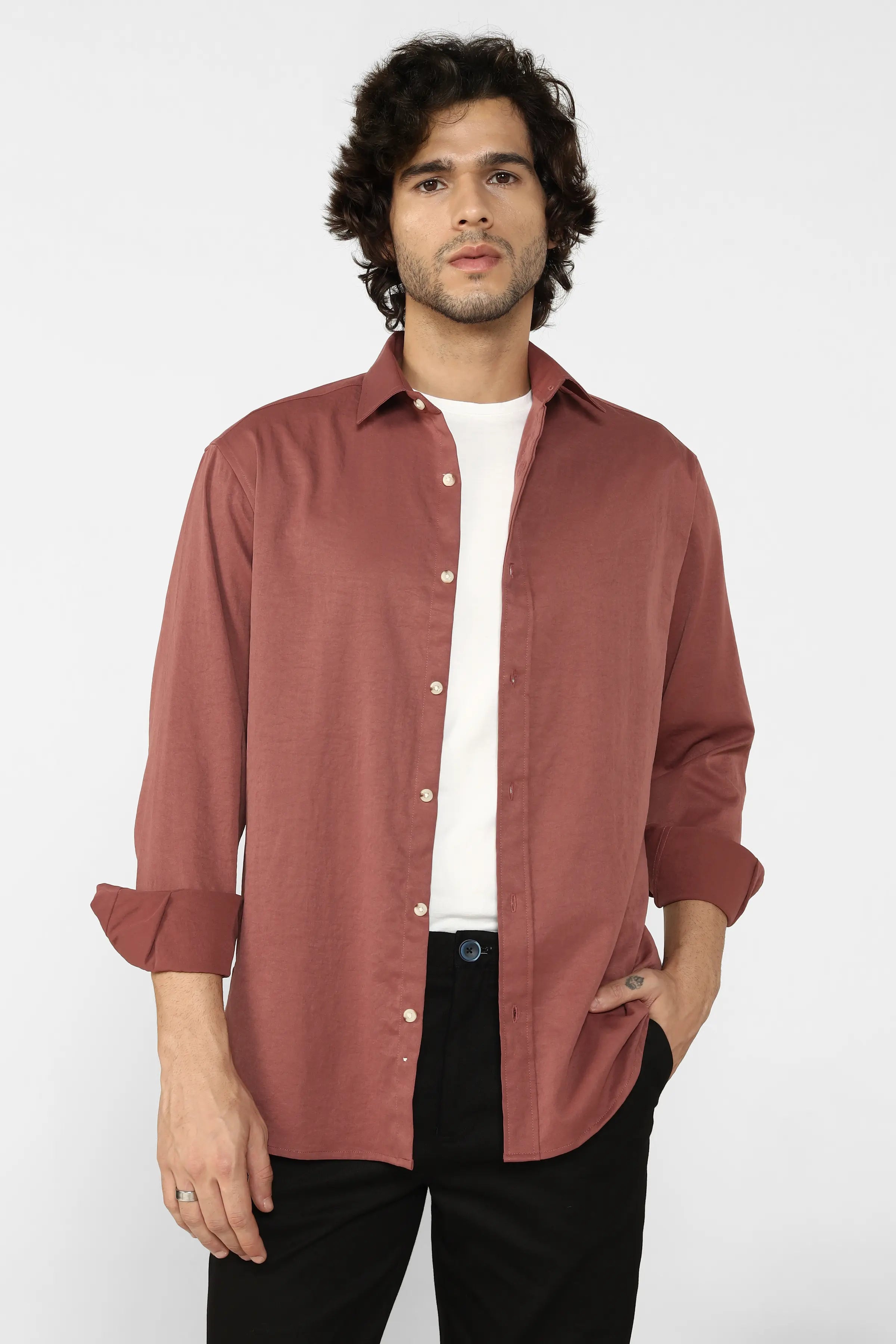 Man wearing a Rust Creased Cotton Shirt over a white t-shirt on a white background