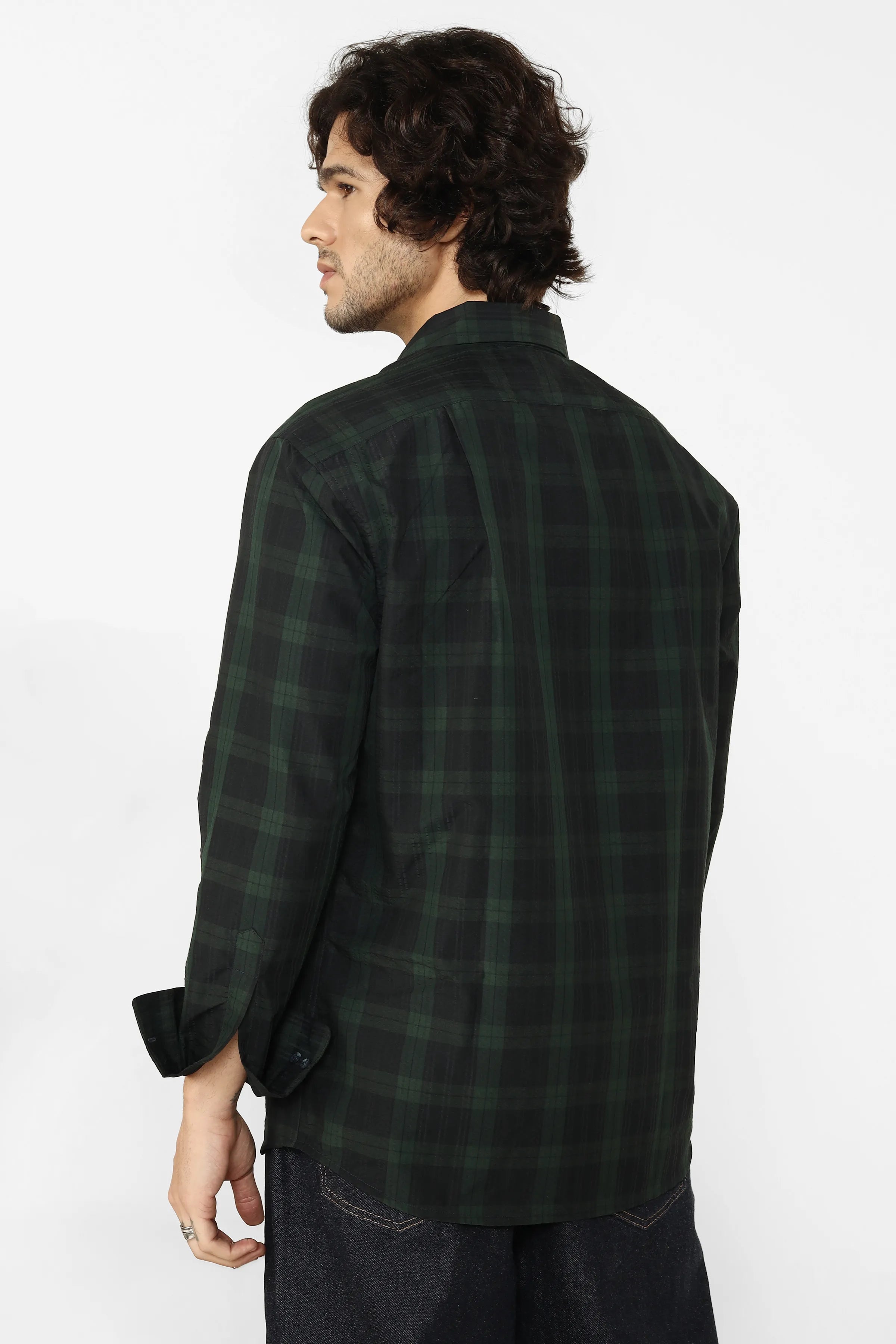 Man wearing a green shirt on a white background
