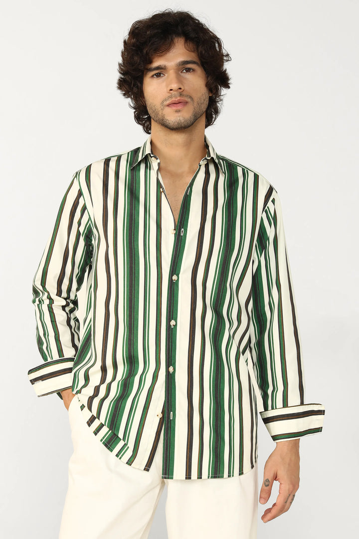 Man wearing a green and white striped shirt against a plain background