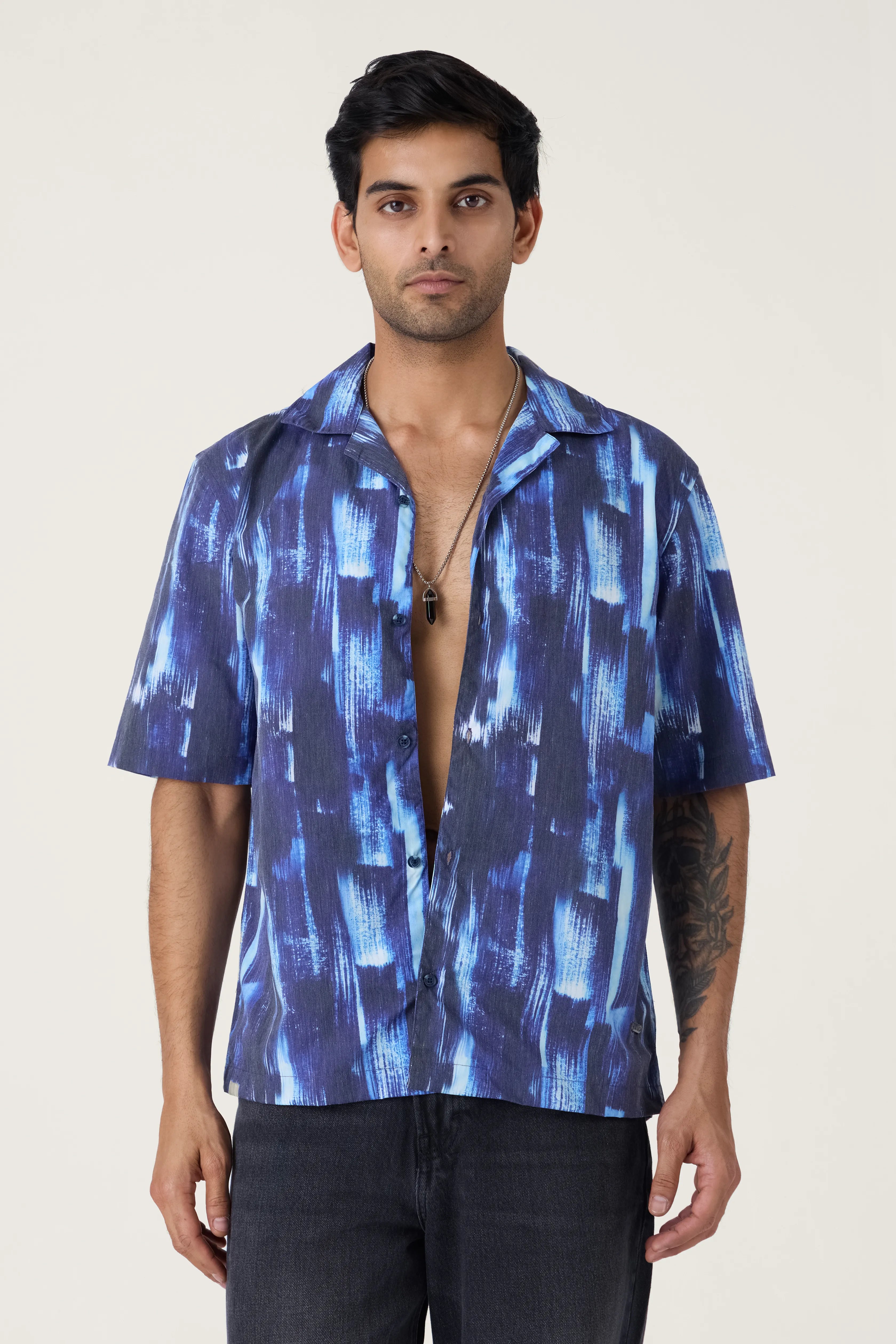 Men Standing in NIGHT SKY PRINTED SHIRT  with black jeans. 