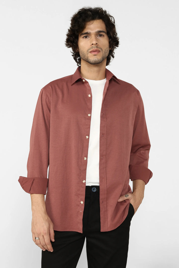 Man wearing a Rust Creased Cotton Shirt over a white t-shirt on a white background
