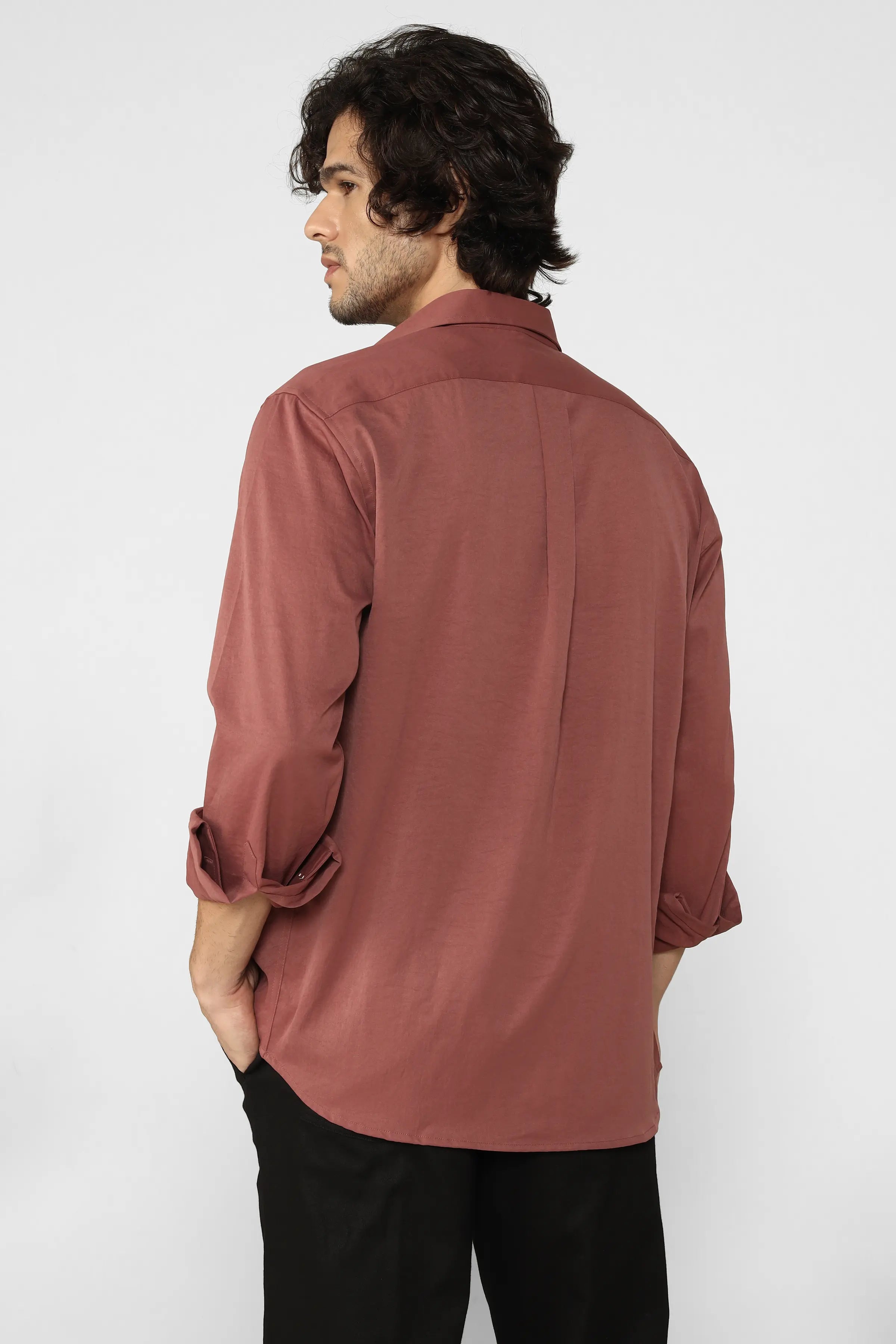 Man wearing a Rust Creased Cotton Shirt against a white background