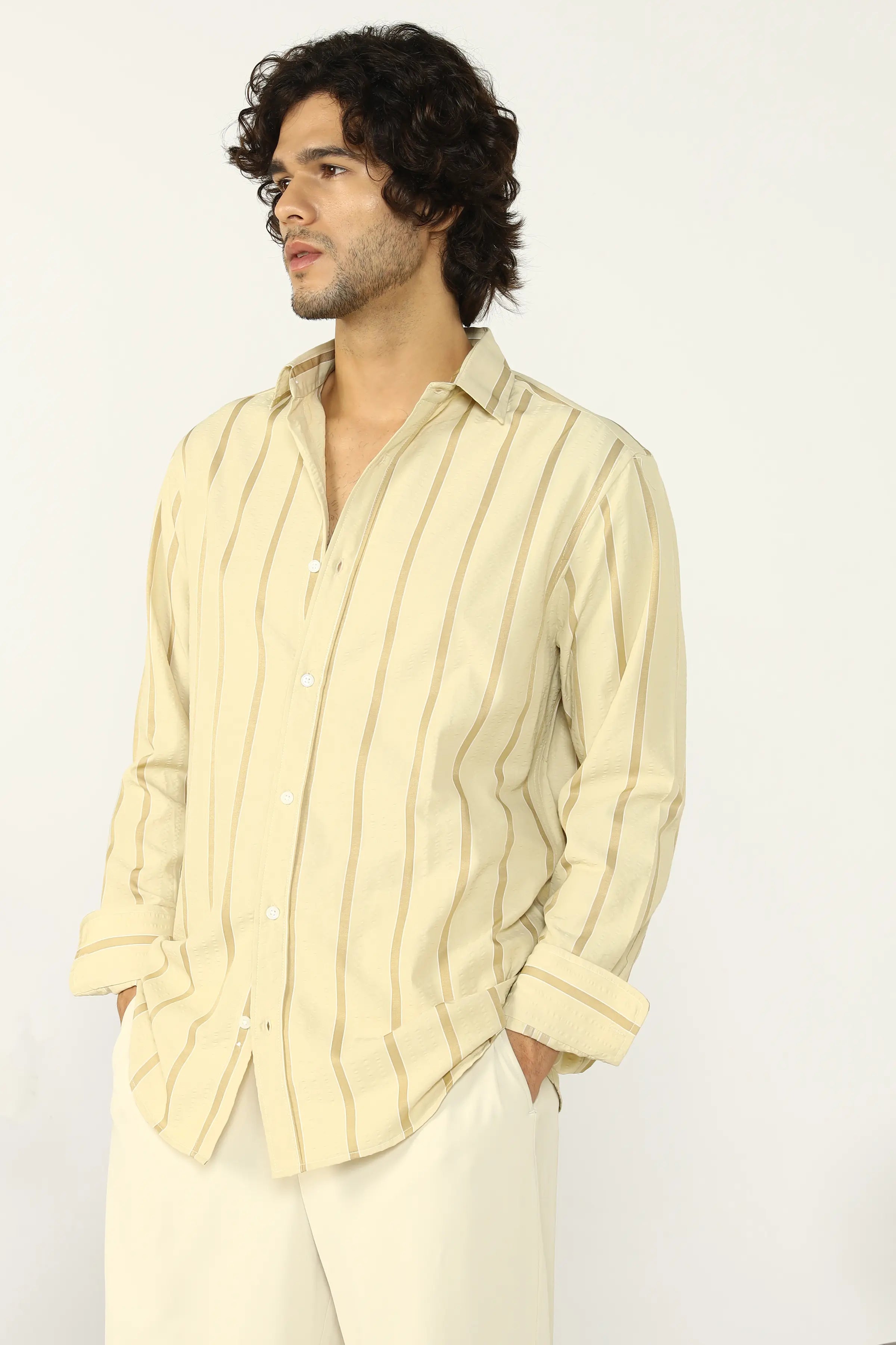 Man wearing a Yellow Seersucker striped shirt and pants on a white background