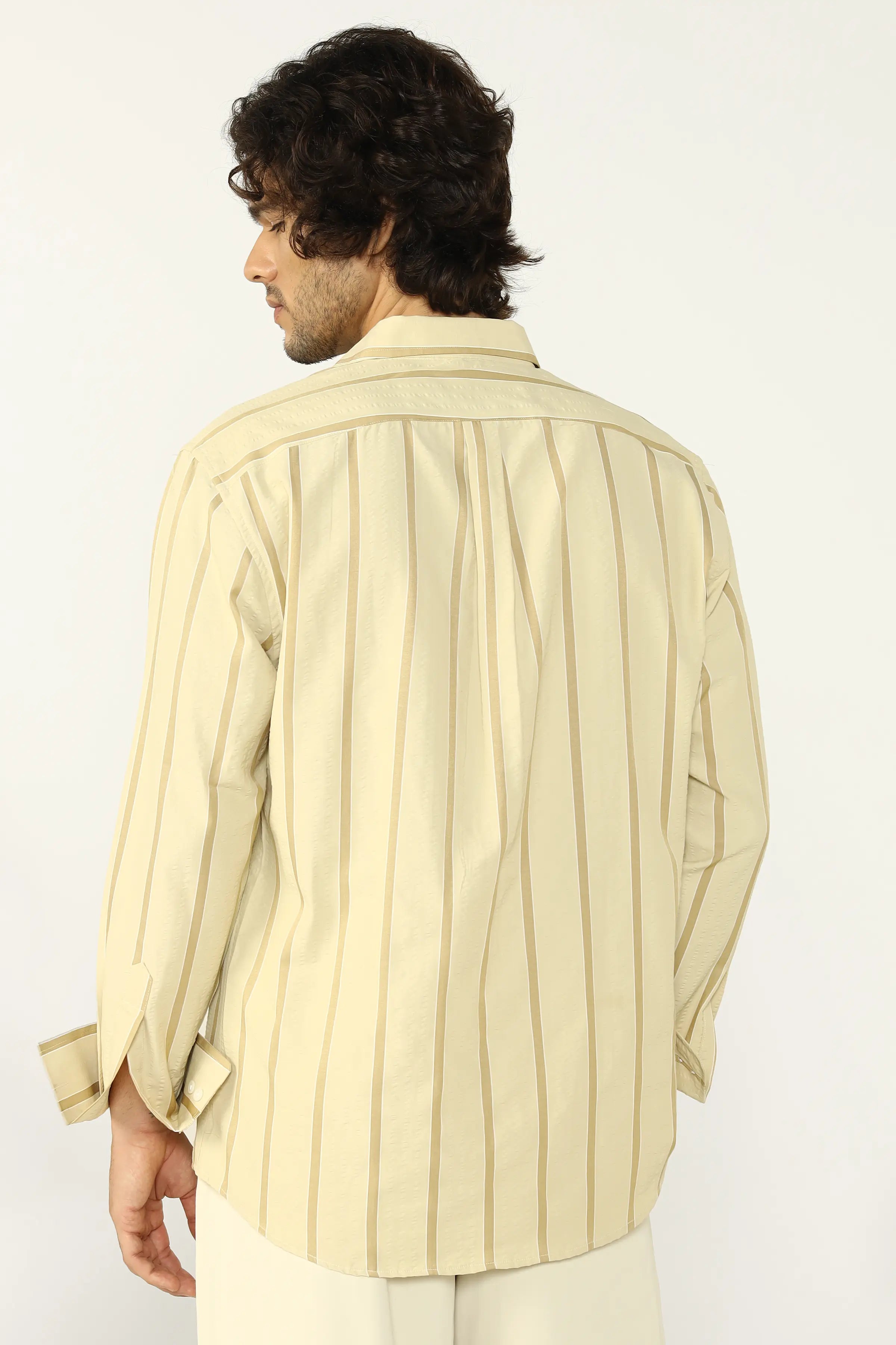 Man wearing a Yellow Seersucker striped shirt on a white background